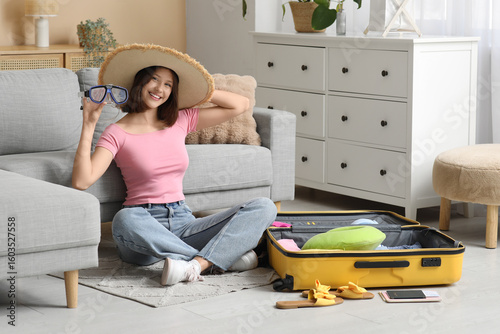 Young woman in hat with div...