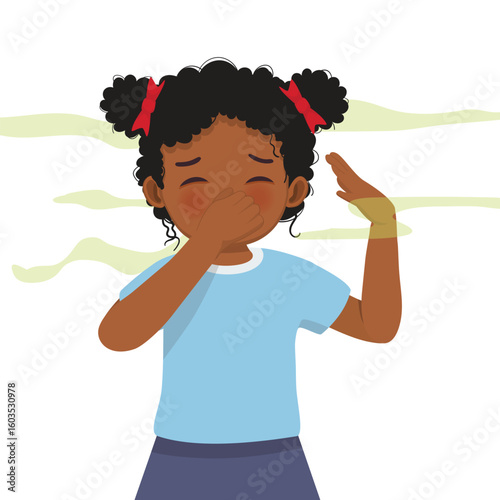 Little African girl smelling something stinky pinching and covering his nose with his hand