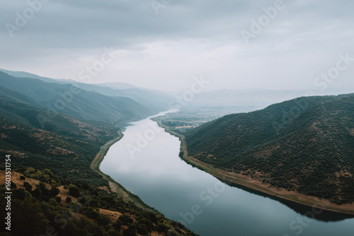 breathtaking view of reservoir edge in iran under overcast sky captured from topdown perspective