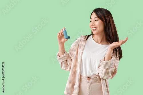 Happy young Asian woman wit...