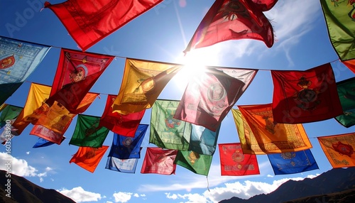 Colorful prayer flags billowing in a clear blue sky