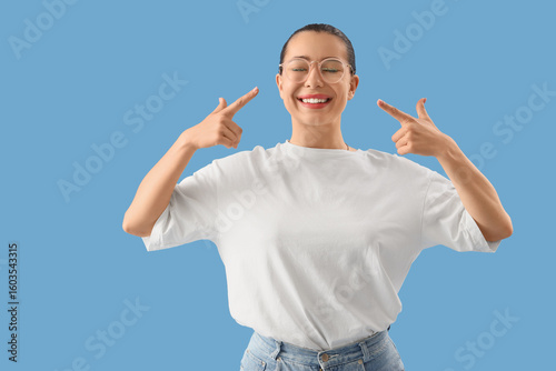 Young woman pointing at sty...