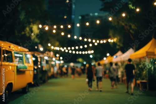 Night market, blurred figures, string lights, food trucks