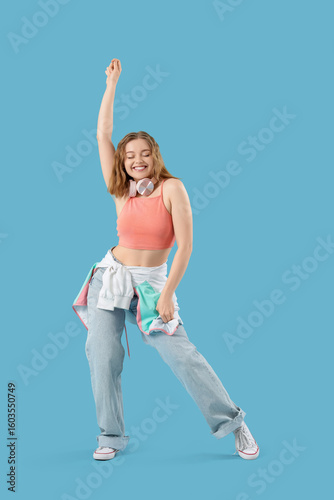 Cool young woman dancing on...