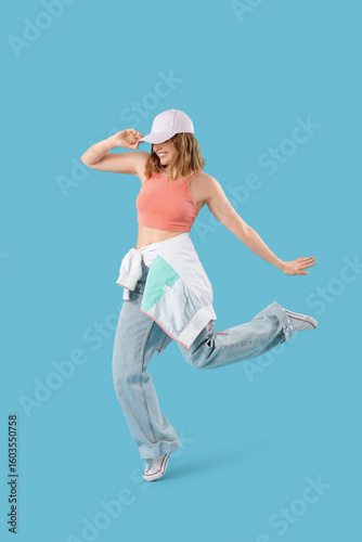 Cool young woman dancing on...