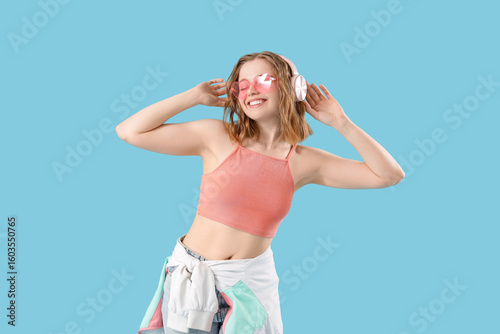Cool young woman listening ...
