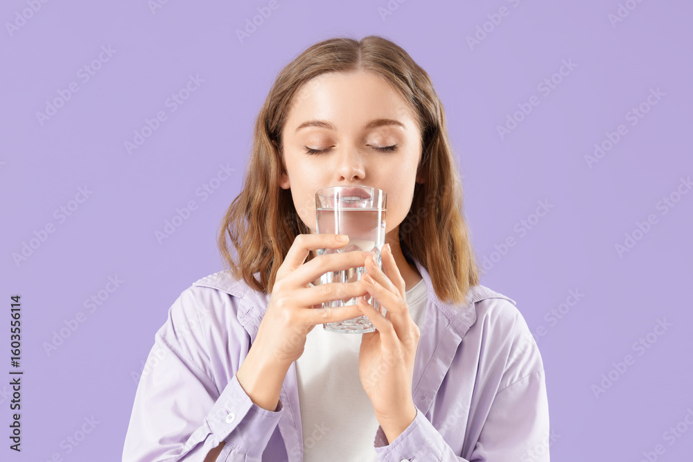Young woman drinking fresh water on lilac background Young woman drinking fresh water on lilac background