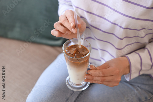 Wallpaper Mural Young woman with glass of iced latte sitting at home, closeup Torontodigital.ca