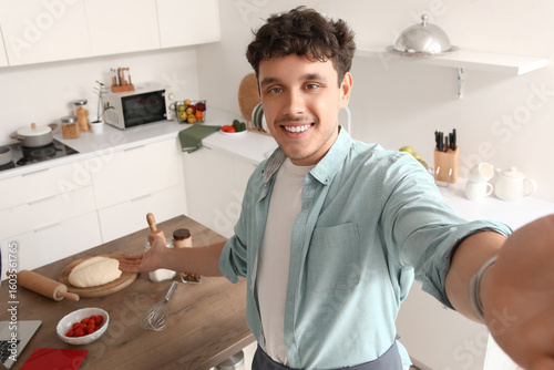 Male blogger cooking while ...