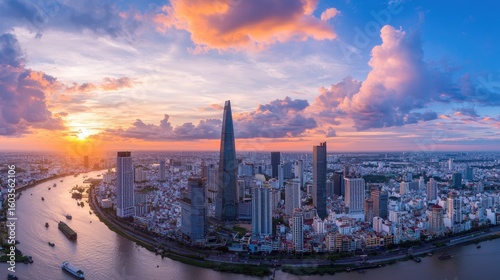 Aerial View of Ho Chi Minh City Skyline at Sunset with Colorful Clouds Reflecting in the Water