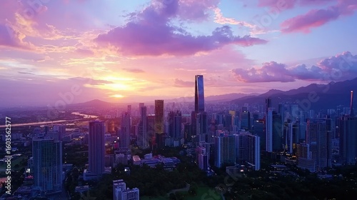 Aerial View of Modern Cityscape at Sunset with Vibrant Clouds and Skyscrapers Against Dramatic Sky