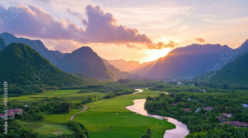 Serene Landscape with Majestic Mountains, Flowing River, and Lush Green Fields at Sunset