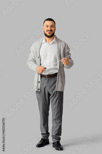 Male teacher with pointer o...
