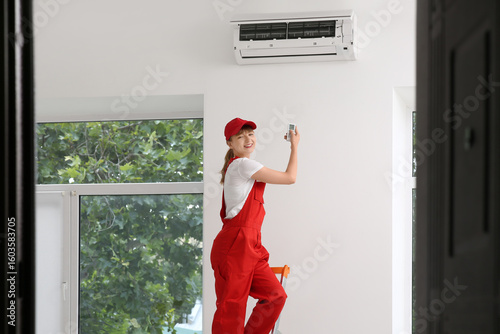 Female technician turning o...