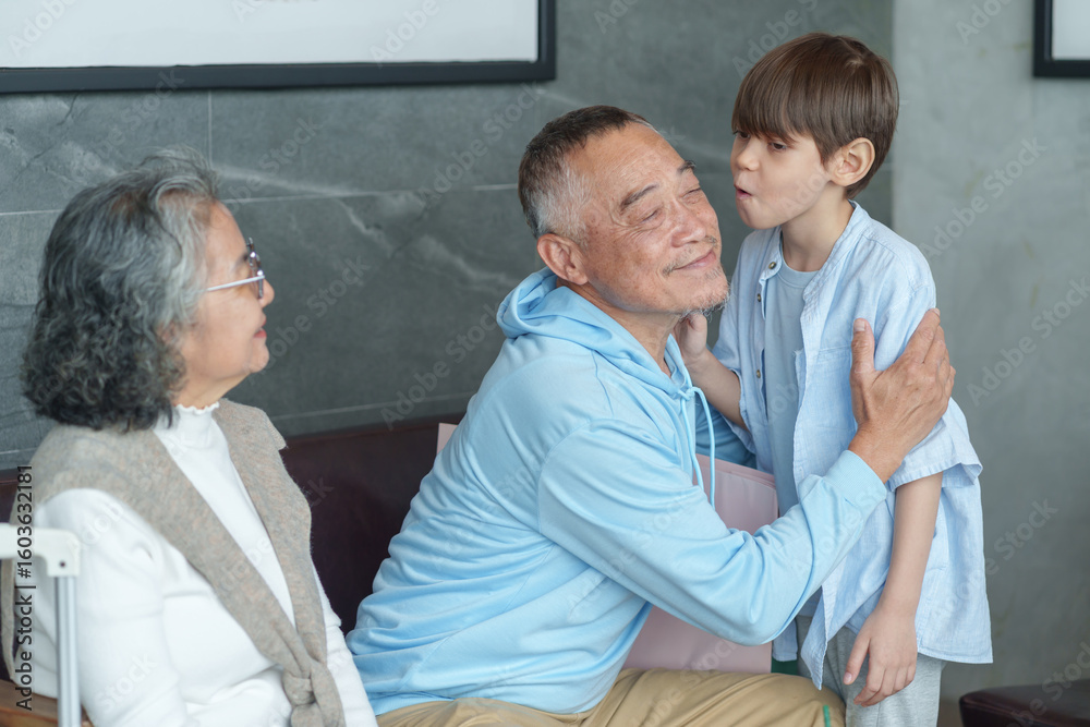 Fototapeta premium group of the generations family take a break coffee together at coffee shop,resting during travel,bonding grandson kiss on cheek grandfather