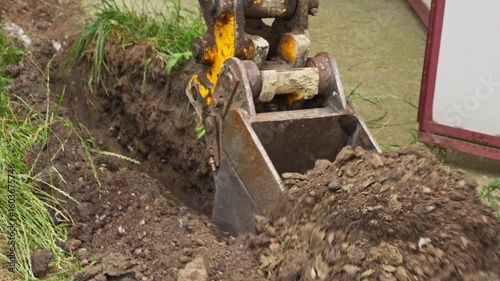 Wallpaper Mural Excavator Bucket Digging On The Ground. - closeup shot Torontodigital.ca