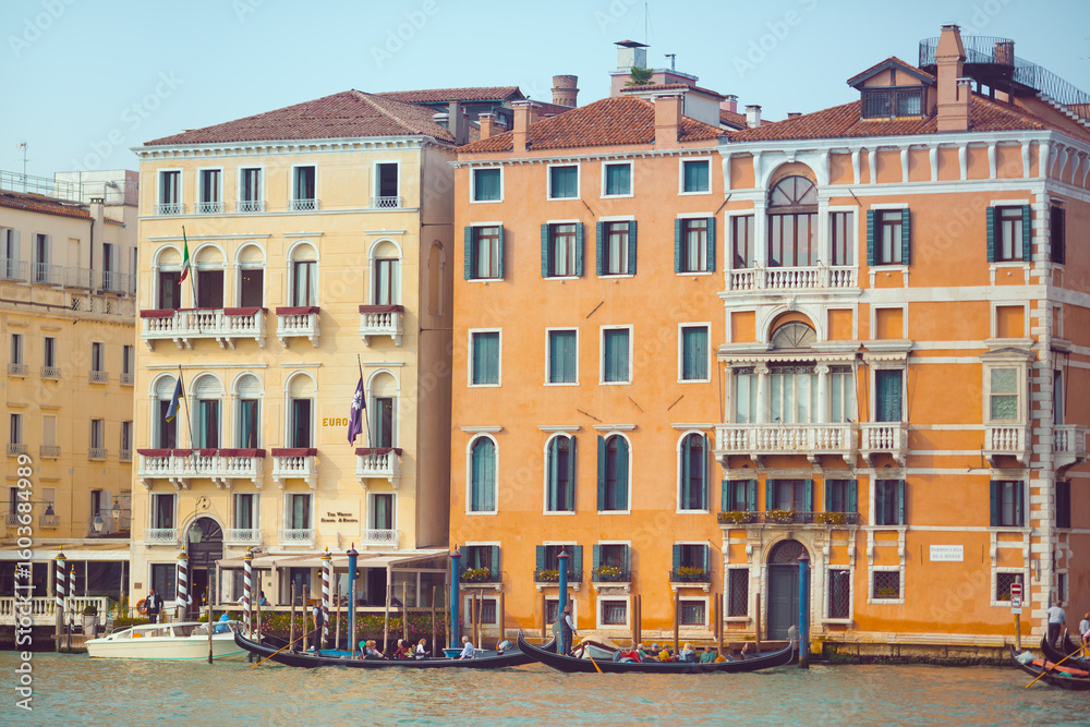 Naklejka premium Traditional Colorful Buildings and Gondolas on Grand Canal in Venice, Italy