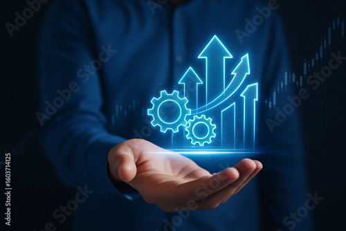 Process to increase productivity concept. Businessman holding productivity icon with growth graph for industrial management