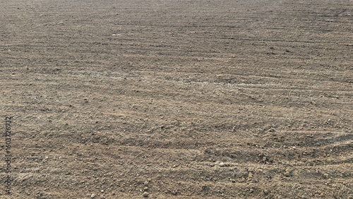 Konstfotografi Arable land shows freshly plowed soil that appears ready for seeding new crops