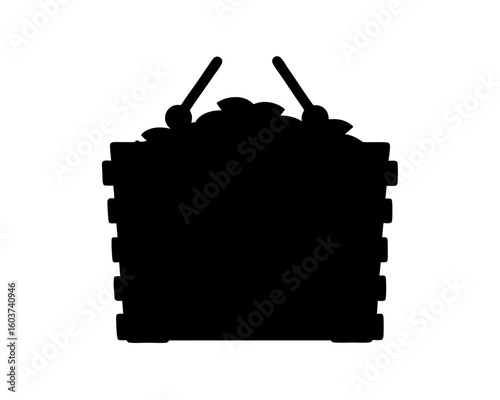 Silhouette image of a woven xylophone instrument with mallets on top