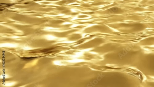 Golden rippling water surface reflecting light in a serene setting