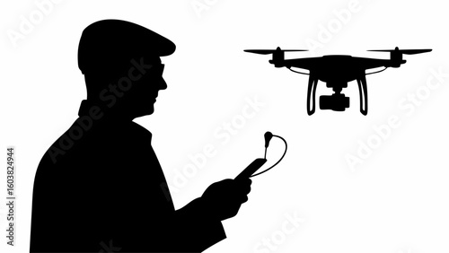 Silhouette of a man wearing a cap operating a drone with a remote control in his hand in black and white