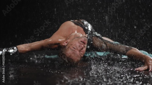 A mesmerizing dance performance showcasing captivating water splashes and dramatic lighting effects