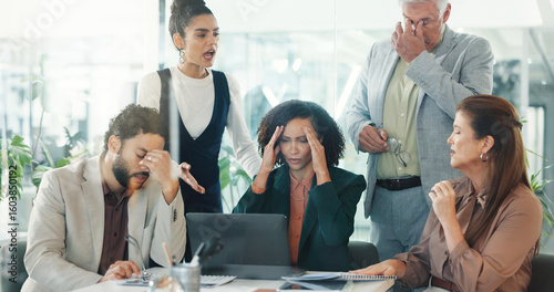 Stress, business people and laptop in office, group and frustrated with bankruptcy. Poor investment, men or women in workplace, PC and fail with stock market crash, online mistake or financial crisis