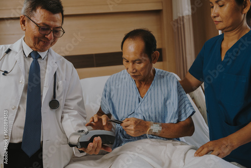 Patients are using money and credit cards to pay for medical services after successful treatment.