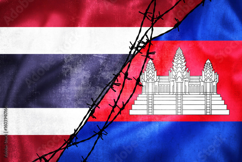Grunge flags of Thailand and Cambodia divided by barb wire illustration