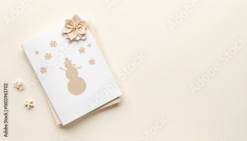 Winter greeting card featuring a snowman design with decorative elements on a neutral background