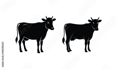 Two black silhouette cows standing side by side on white background