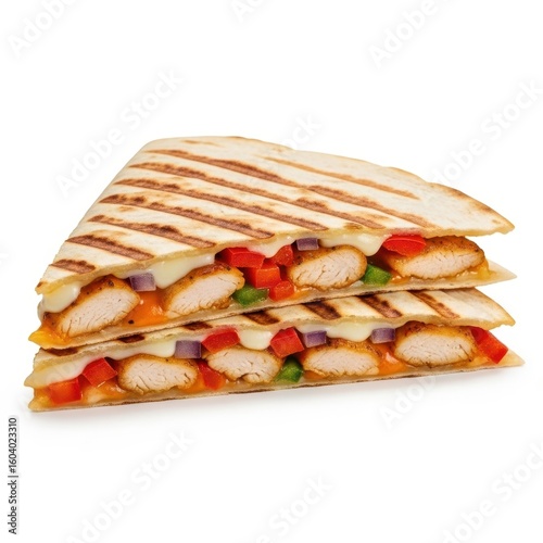 Grilled chicken quesadilla cut in half with melted cheese
