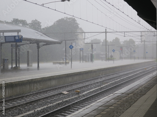 railway station Apeldoorn Netherlands in the pouring rain