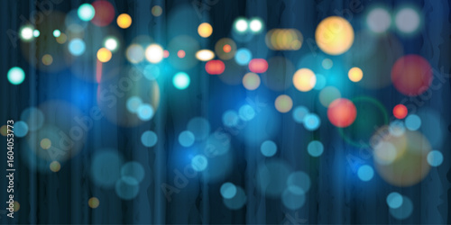 Water drops flowing down the window with streetlights and car headlights, city night scene