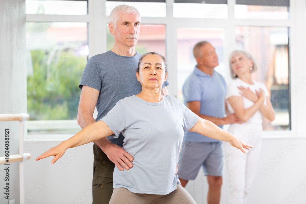 Obraz premium Ballet performed by elderly people in a ballet studio