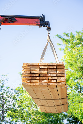 Unloading boards. Construction. Building materials