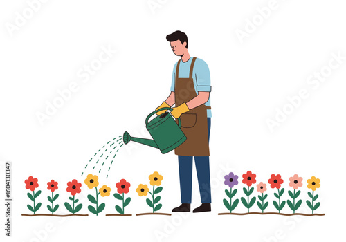 A gardener waters a colorful flowerbed with a green watering can