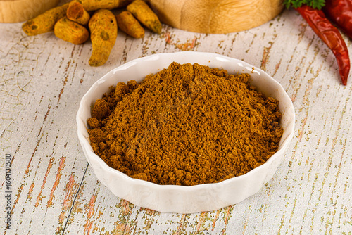 Fototapeta Naklejka Na Ścianę i Meble -  Indian cuisine - curry powder for culinary
