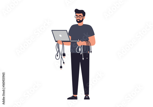 Man w glasses beard stands holding laptop cables Dressed in casual dark clothing