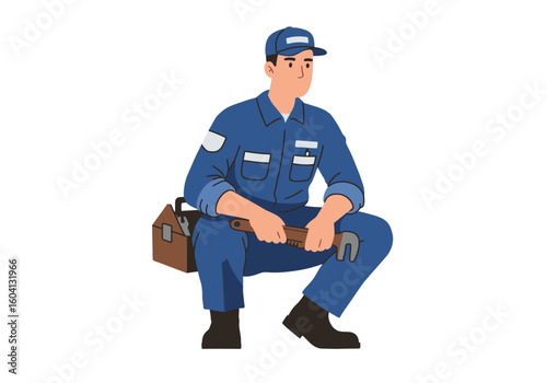 Man squats with toolbox holding wrench wearing uniform and cap