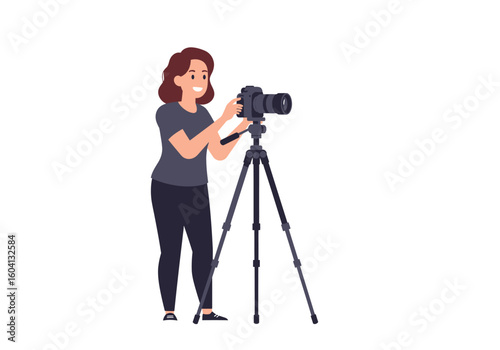 Smiling woman adjusts a camera mounted on a tripod