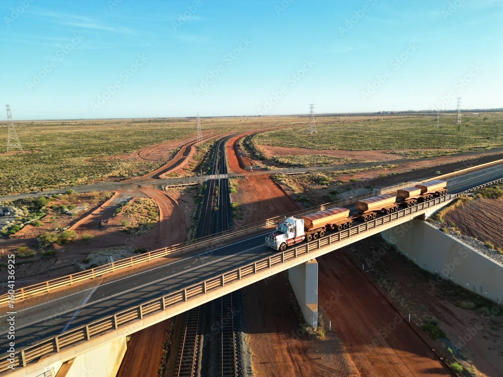 Fototapeta premium Road Train on bridge on sunrise