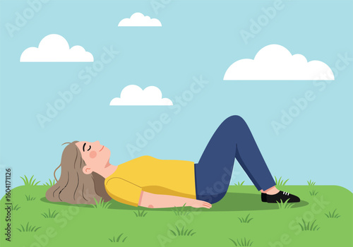 A woman reclines on grass, eyes closed, enjoying a peaceful moment under a blue sky with clouds.