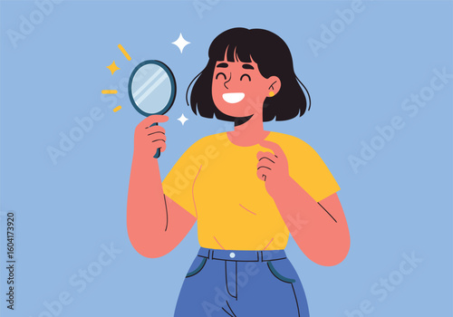 A cheerful young woman happily looking at her reflection in a small mirror, radiating self-confidence and positive self-image.