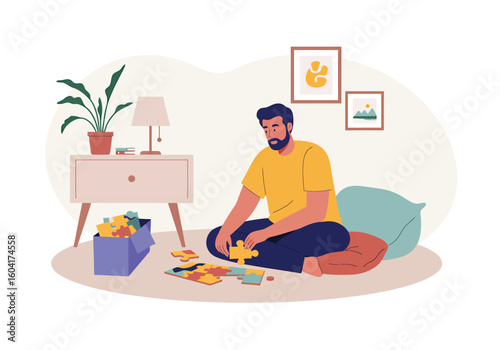 A bearded man sits on the floor at home, focused on assembling a colorful jigsaw puzzle as a relaxing hobby.