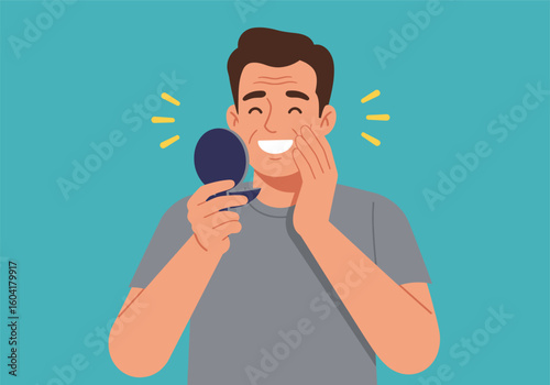 Smiling man looking at himself in a hand-held mirror, pleased with his appearance.