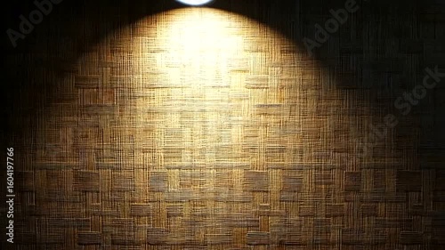 Textured bamboo wall illuminated by spotlights creates a warm and inviting atmosphere, perfect for