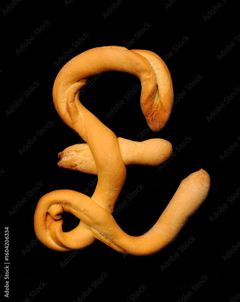 Obraz premium Bread stick shaped in the Pound symbol. 