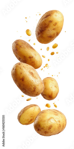 Fresh potatoes in mid-air, with potato pieces exploding around